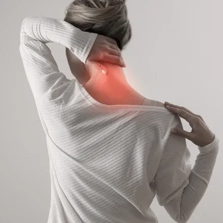 A woman with neck pain indicated in red